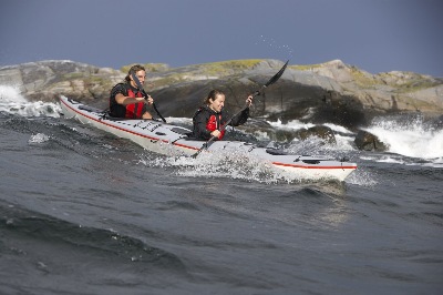 Lina and Paul tackle waves in DoubleShot double kayak